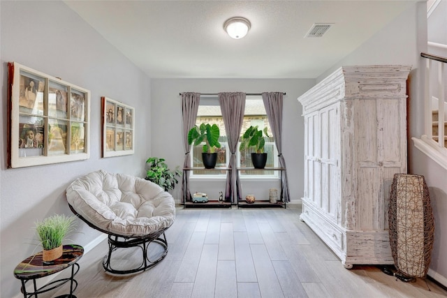 living area featuring hardwood / wood-style flooring