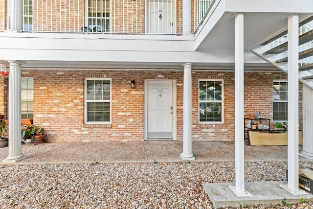 entrance to property featuring a balcony