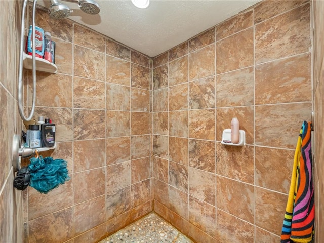 bathroom with a tile shower