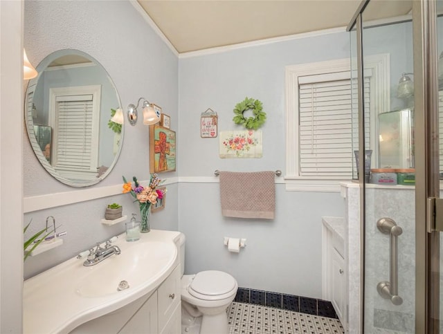 bathroom featuring vanity, toilet, and ornamental molding