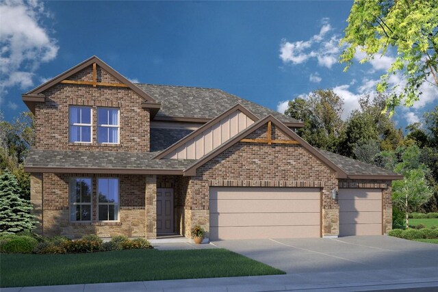 view of front of house featuring a garage and a front yard