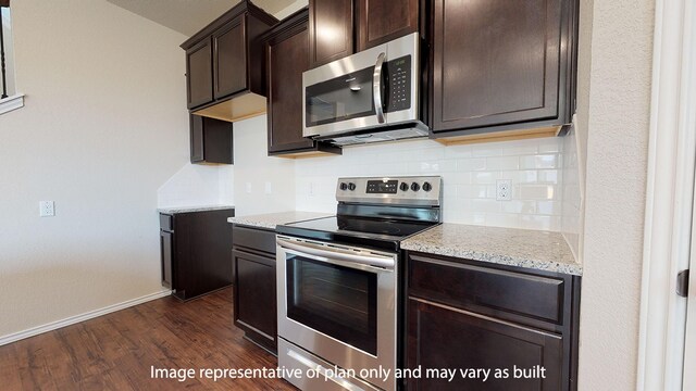 kitchen with light stone counters, dark hardwood / wood-style floors, tasteful backsplash, dark brown cabinets, and appliances with stainless steel finishes