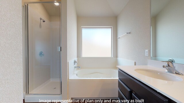 bathroom featuring shower with separate bathtub and vanity