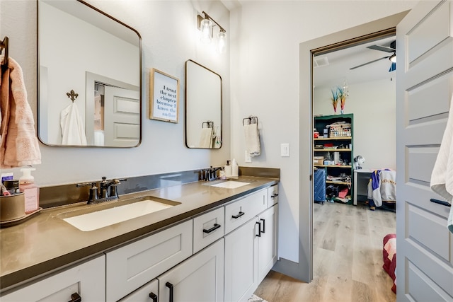 bathroom with vanity, wood-type flooring, and ceiling fan