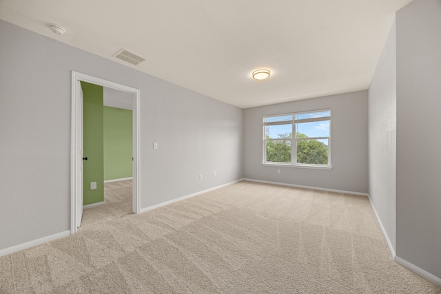 empty room with light colored carpet