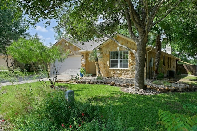 view of front of house with a garage and central air condition unit