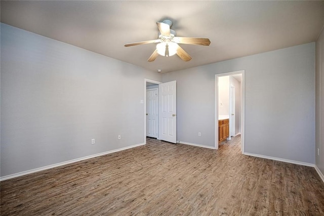 unfurnished bedroom with hardwood / wood-style flooring, ceiling fan, and ensuite bathroom