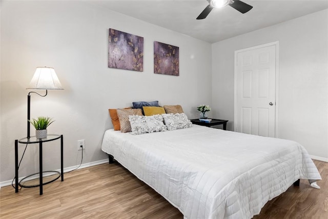 bedroom featuring ceiling fan and hardwood / wood-style flooring