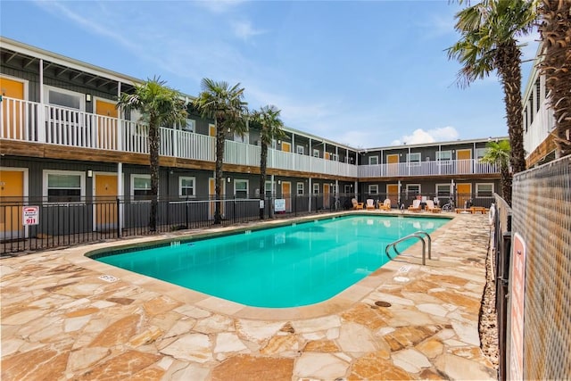 view of swimming pool with a patio