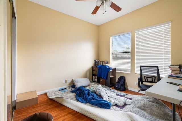 office space featuring wood-type flooring and ceiling fan