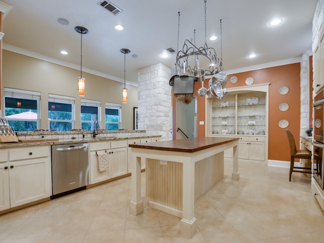 kitchen with dishwasher, a center island, hanging light fixtures, ornamental molding, and a breakfast bar area