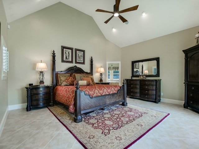 tiled bedroom with ceiling fan and high vaulted ceiling