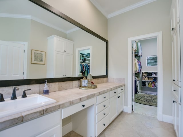 bathroom with decorative backsplash, vanity, and ornamental molding