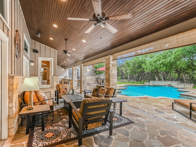 view of swimming pool with an outdoor living space, ceiling fan, and a patio area