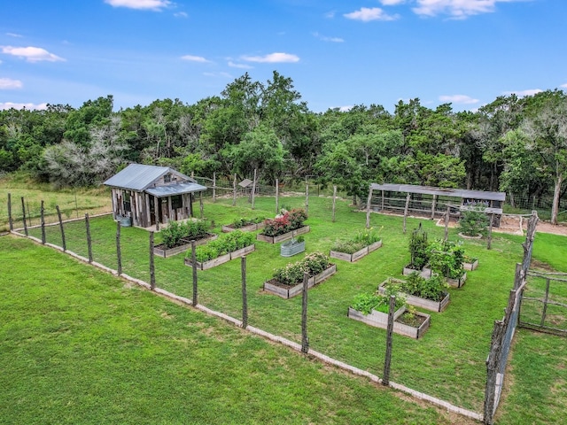 view of yard with an outbuilding and a rural view