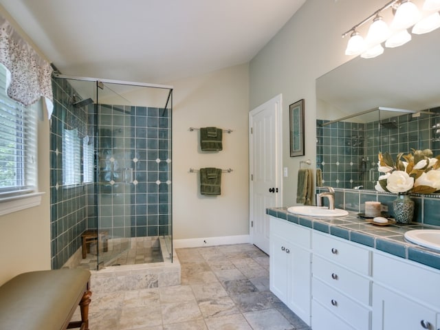 bathroom featuring vanity and an enclosed shower