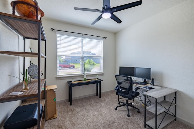 office area with light colored carpet and ceiling fan