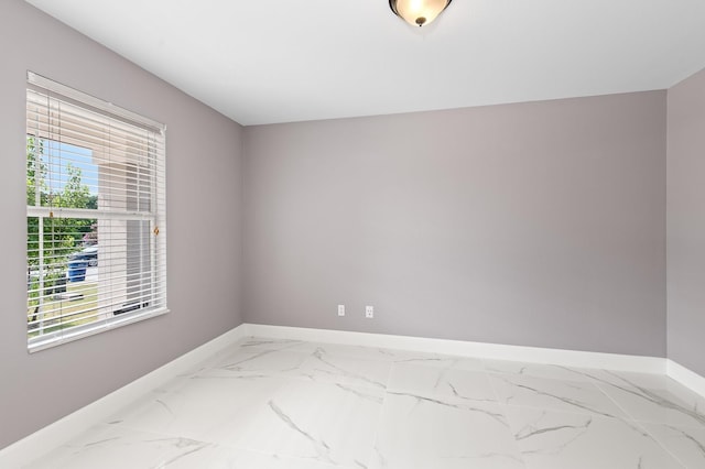 spare room featuring a wealth of natural light