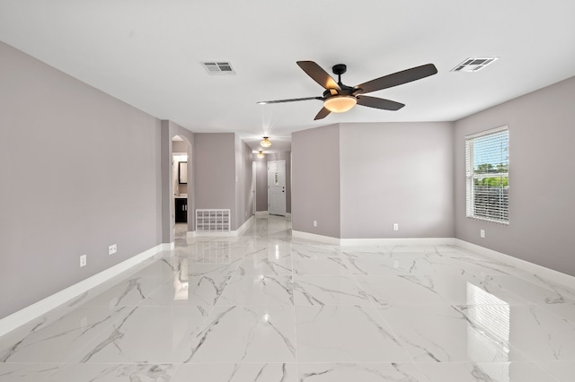 unfurnished room featuring ceiling fan