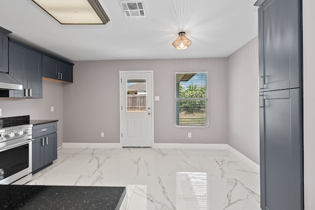 kitchen with stainless steel range, wall oven, and ventilation hood