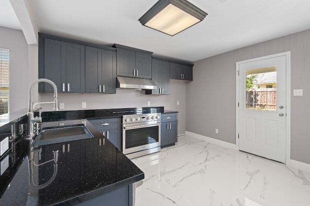 kitchen with sink, dark stone countertops, and stainless steel electric range