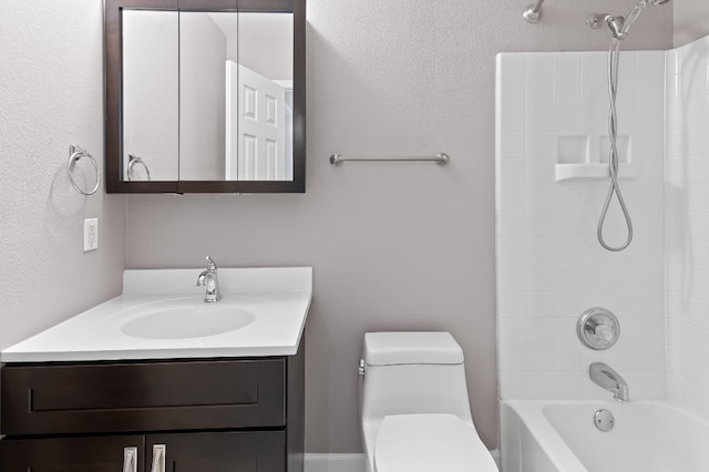 full bathroom featuring toilet, vanity, and bathtub / shower combination