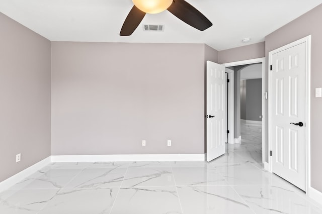 unfurnished room with ceiling fan