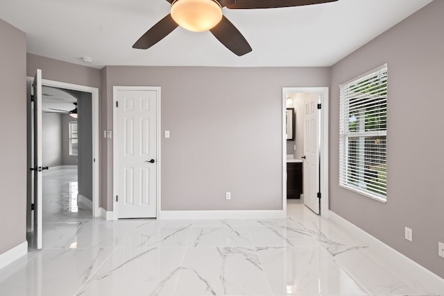 bedroom with ceiling fan and ensuite bathroom