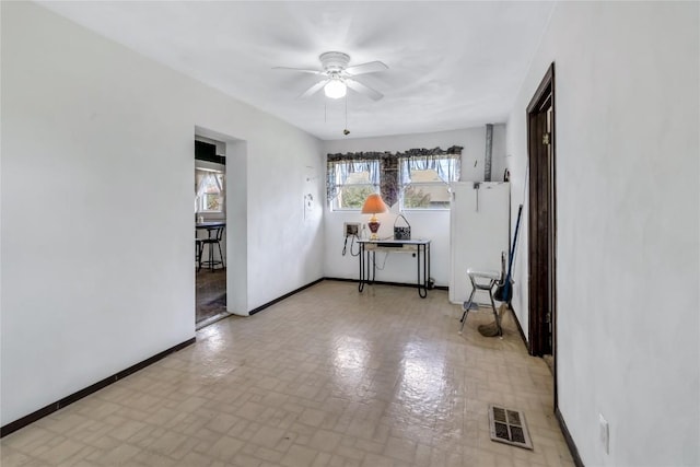 unfurnished room featuring ceiling fan