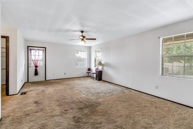 carpeted empty room with ceiling fan