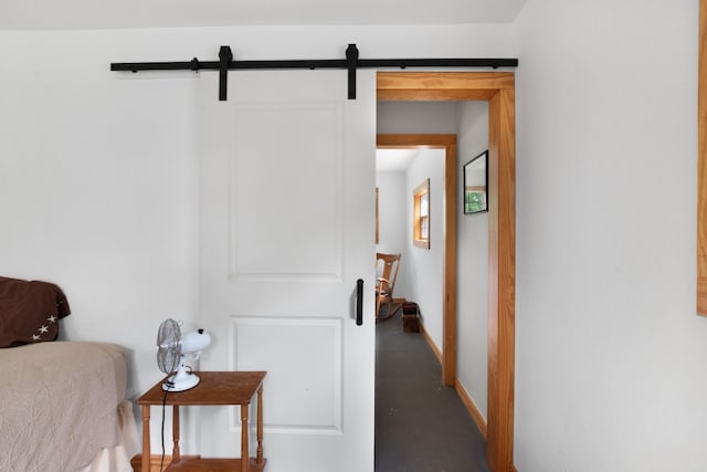 hallway featuring a barn door