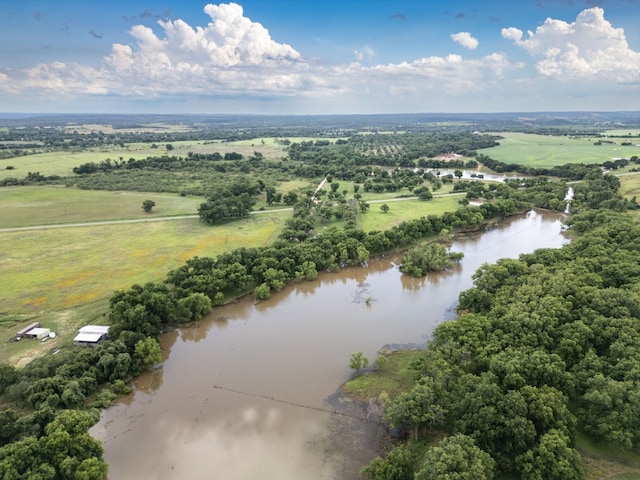 drone / aerial view with a rural view and a water view