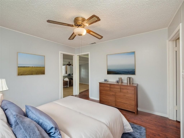 bedroom featuring a textured ceiling, dark hardwood / wood-style flooring, and ceiling fan