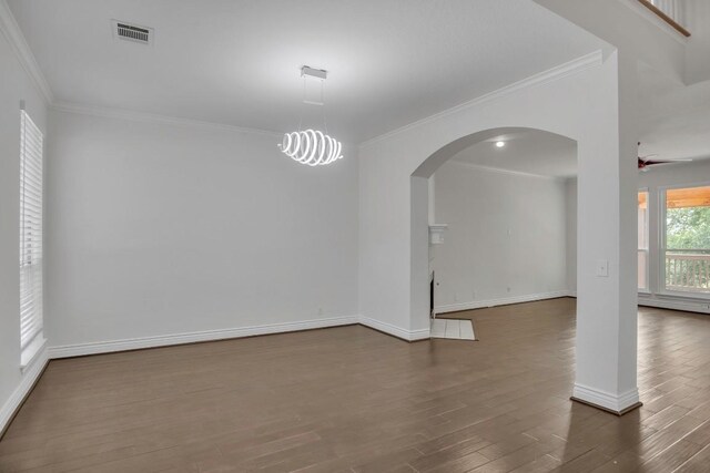 3917 Canyon Glen Cir, Austin, TX 78732 - empty room featuring ceiling fan, dark hardwood / wood-style flooring, and crown molding