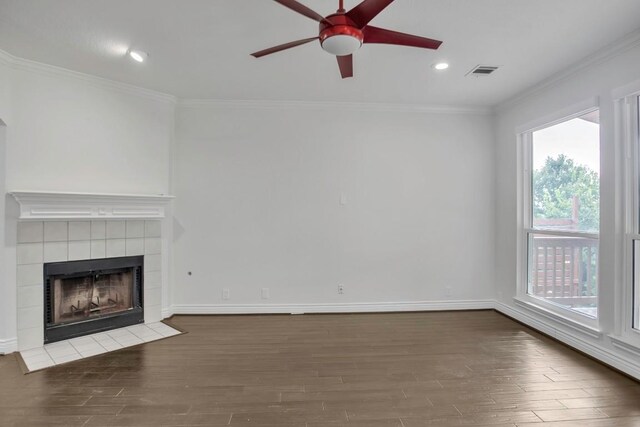 3917 Canyon Glen Cir, Austin, TX 78732 - unfurnished living room with dark hardwood / wood-style floors, ceiling fan, crown molding, and a fireplace
