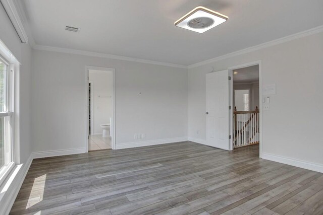 3917 Canyon Glen Cir, Austin, TX 78732 - unfurnished room with ornamental molding and light hardwood / wood-style flooring