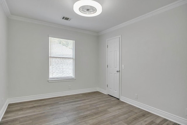 3917 Canyon Glen Cir, Austin, TX 78732 - spare room with ornamental molding and light wood-type flooring