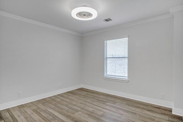 3917 Canyon Glen Cir, Austin, TX 78732 - spare room featuring light wood-type flooring and crown molding