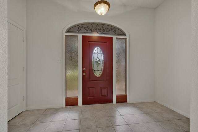 foyer entrance featuring light tile patterned floors