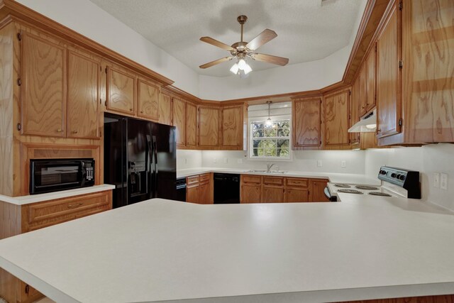 kitchen featuring kitchen peninsula, sink, ceiling fan, and black appliances