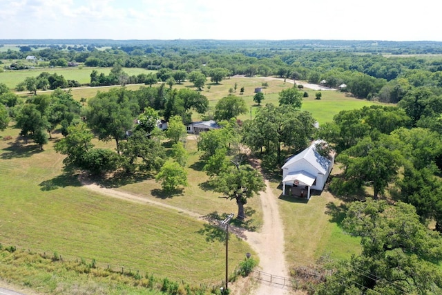 birds eye view of property with a rural view