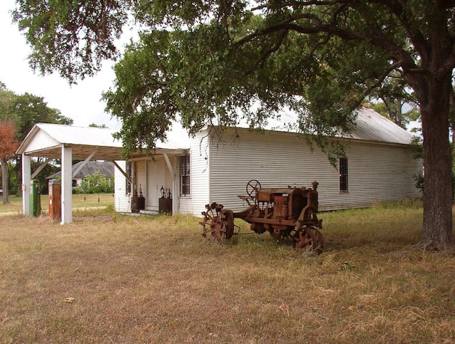 back of house with a yard