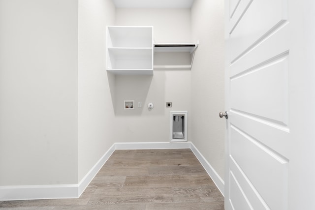 laundry room featuring light wood-type flooring, hookup for a washing machine, hookup for an electric dryer, and gas dryer hookup