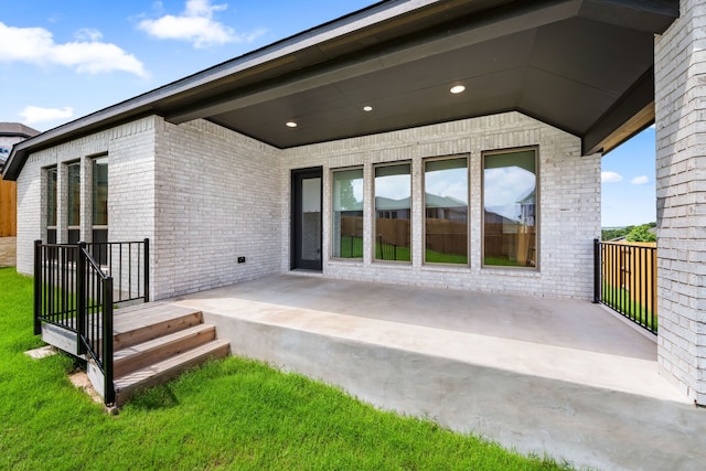 back of property featuring a patio