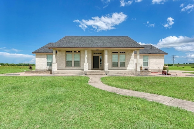 view of front of house with a front lawn and covered porch