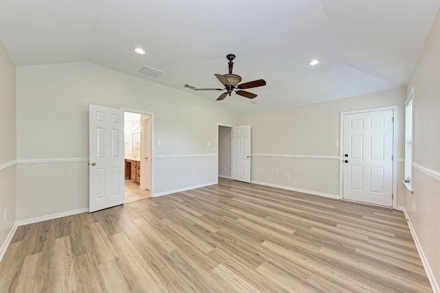 unfurnished room with lofted ceiling, ceiling fan, and light hardwood / wood-style flooring