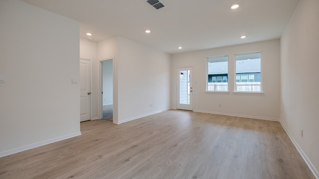 unfurnished room featuring light wood-type flooring