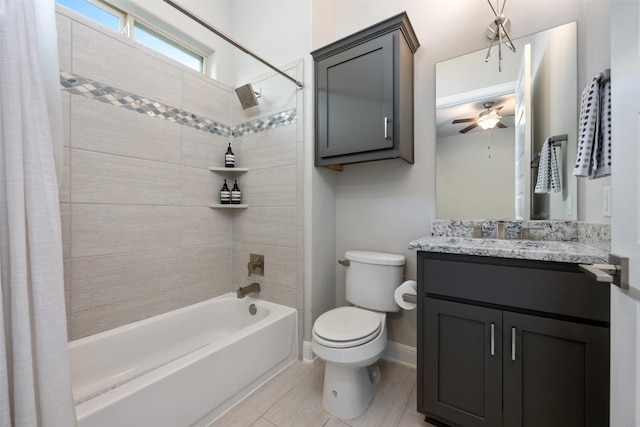 full bathroom featuring vanity, shower / tub combo with curtain, ceiling fan, tile patterned flooring, and toilet