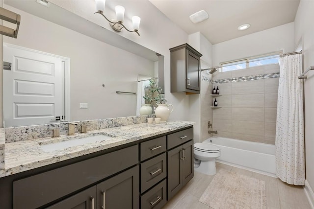 full bathroom with shower / tub combo, vanity, and toilet