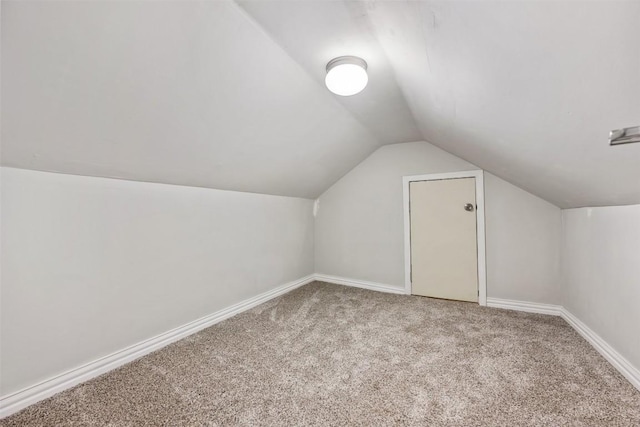 bonus room with carpet and lofted ceiling